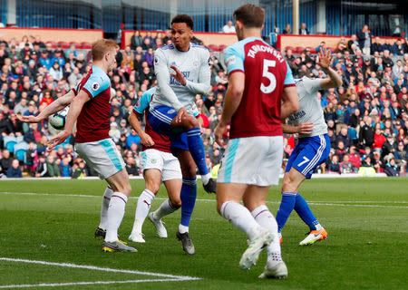 Soccer Football - Premier League - Burnley v Cardiff City - Turf Moor, Burnley, Britain - April 13, 2019 Cardiff City's Harry Arter and Josh Murphy in action with Burnley's Ben Mee Action Images via Reuters/Lee Smith