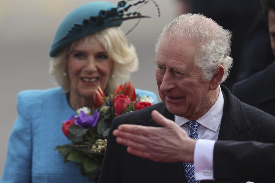 Britain's King Charles III and Camilla, the Queen Consort, arrive at the airport in Berlin, Wednesday, March 29, 2023. King Charles III arrives Wednesday for a three-day official visit to Germany. (Jens Buettner/dpa via AP)