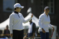 Eun-Hee Ji, left, of South Korea, gestures while talking with Cristie Kerr on the ninth green of the Lake Merced Golf Club during the first round of the LPGA Mediheal Championship golf tournament Thursday, May 2, 2019, in Daly City, Calif. (AP Photo/Eric Risberg)