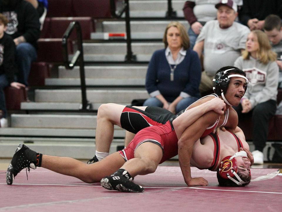 Newark's Nick Harrell beat Groveport's Josh Morrison 11-7 at 113 pounds during a matchup at Jimmy Allen Gymnasium on Thursday, Feb. 9, 2023.