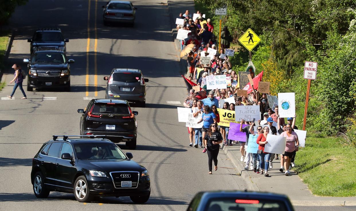 The Eliminate Racial Violence march makes its way up Caldart Ave. to the North Kitsap School District building on Thursday, May 18, 2023.