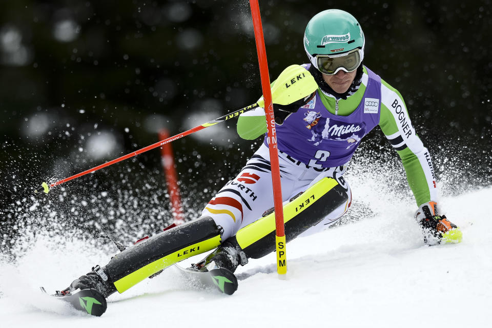 Felix Neureuther of Germany clears a gate during the first run of the men's Alpine skiing slalom World Cup race at the Lauberhorn in Wengen, Switzerland, Sunday, Jan. 19, 2014. (AP Photo/Keystone, Jean-Christophe Bott)