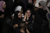 Palestinian mourners react during the funeral of Said Mesha and Adnan Araj in the Balata refugee camp near the West Bank town of Nablus Saturday, May 13, 2023. The Israeli military raided the Balata refugee camp in the West Bank, sparking a firefight that killed Araj and Mesha. Israel said both men were armed. (AP Photo/Majdi Mohammed)