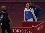 United States's Anastasija Zolotic celebrates with coach after defeating Taiwan's Lo Chia-Ling during the taekwondo women's 57kg match at the 2020 Summer Olympics, Sunday, July 25, 2021, in Tokyo, Japan. (AP Photo/Themba Hadebe)