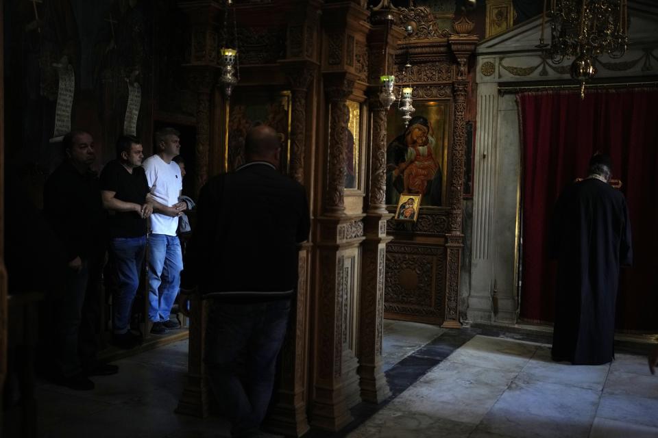 Male visitors attend the afternoon prayers at Pantokrator Monastery in the Mount Athos, northern Greece, on Thursday, Oct. 13, 2022. The monastic community was first granted self-governance through a decree by Byzantine Emperor Basil II, in 883 AD. Throughout its history, women have been forbidden from entering, a ban that still stands. This rule is called "avaton" and the researchers believe that it concerns every form of disturbance that could affect Mt. Athos. (AP Photo/Thanassis Stavrakis)
