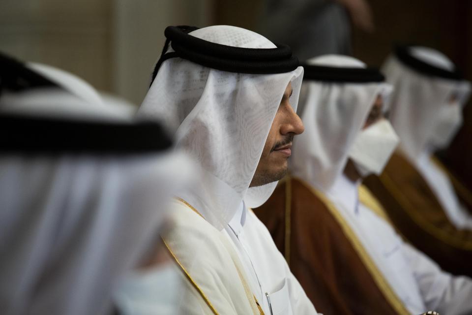 Qatar's Deputy Prime Minister and Foreign Minister Sheikh Mohammed bin Abdulrahman bin Jassim Al-Thani, center, meets with Egyptian Foreign Minister Sameh Shoukry at the Tahrir Palace in Cairo, Egypt, Tuesday, May 25, 2021. (AP Photo/Nariman El-Mofty)