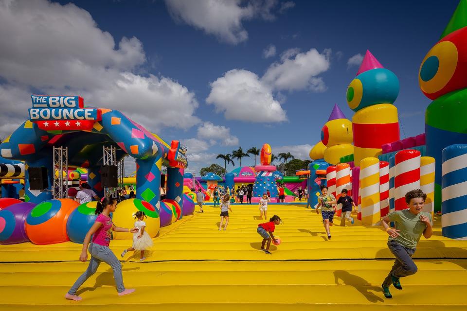 Children play at The Big Bounce America Tour installation at John Prince Park on February 10, 2024, in unincorporated Palm Beach County near Lake Worth Beach, Fla. The gigantic inflatable attractions, including a 24,000 square foot bounce that it touts as the world's largest, will be open through the weekend and Friday, Feb. 16 through Sunday, Feb. 18.