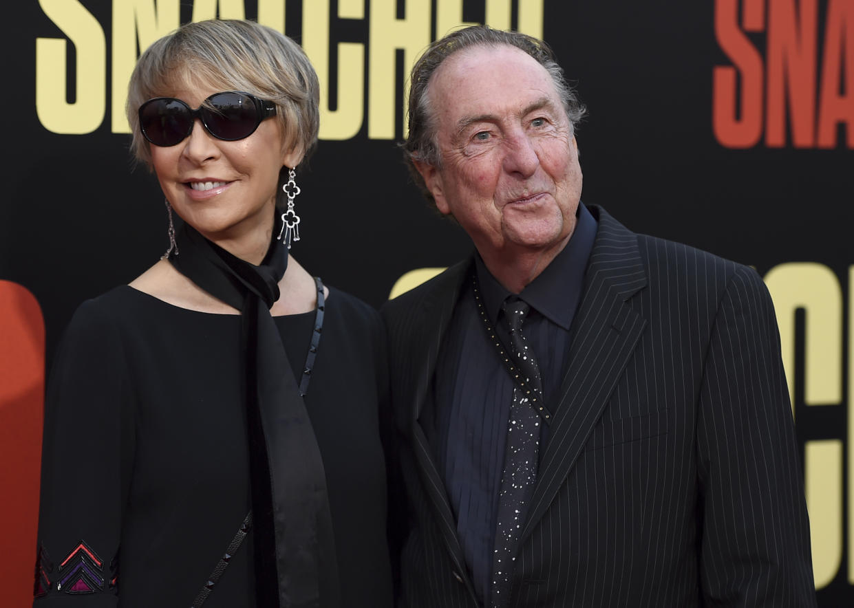 Tania Kosevich, left, and Eric Idle. (Credit: Jordan Strauss/Invision/AP)