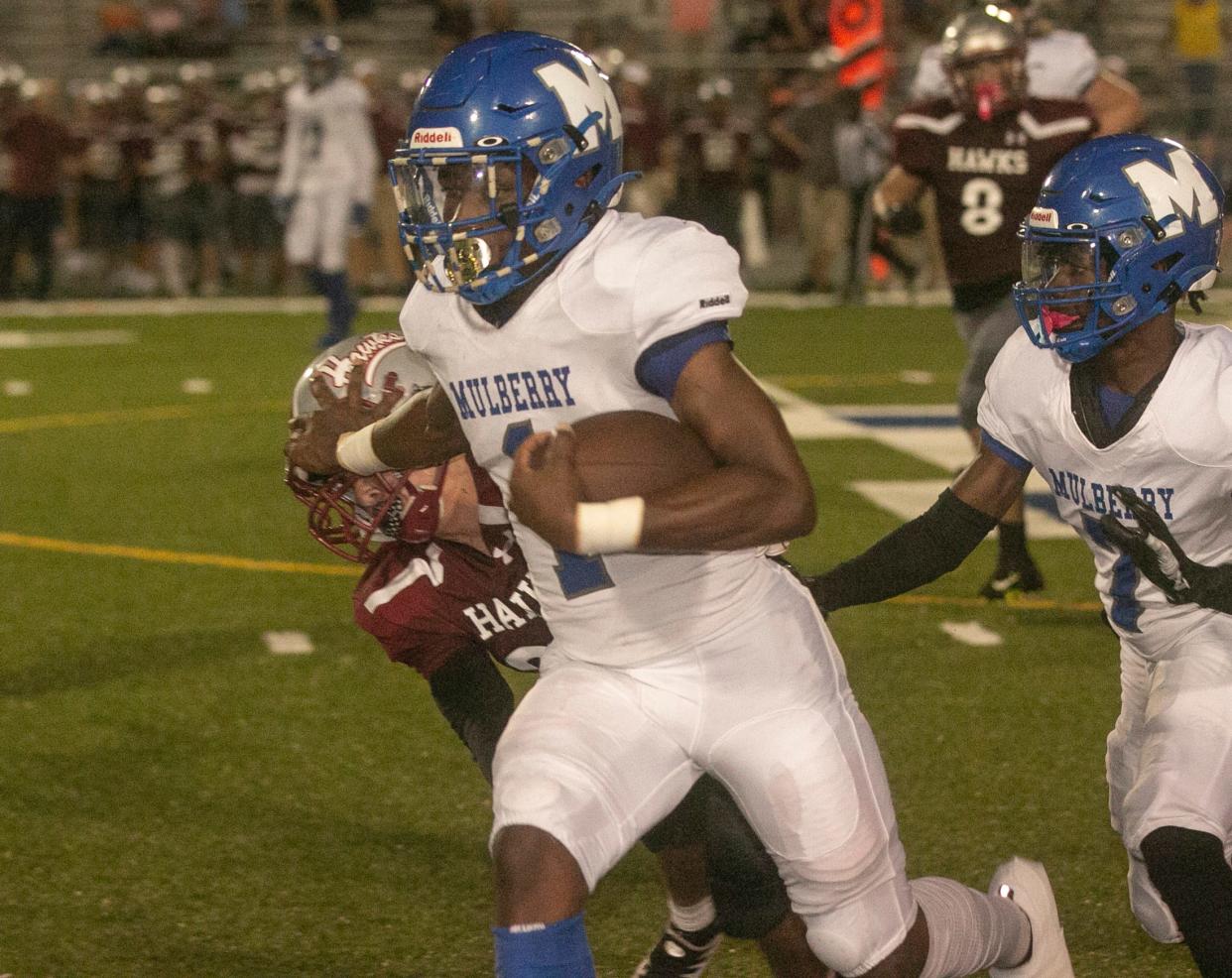 Mulberry High School running back Lloyd Knight (1) rushes the ball during the first half against Santa Fe High School at Mulberry High Friday night. September 23, 2022.