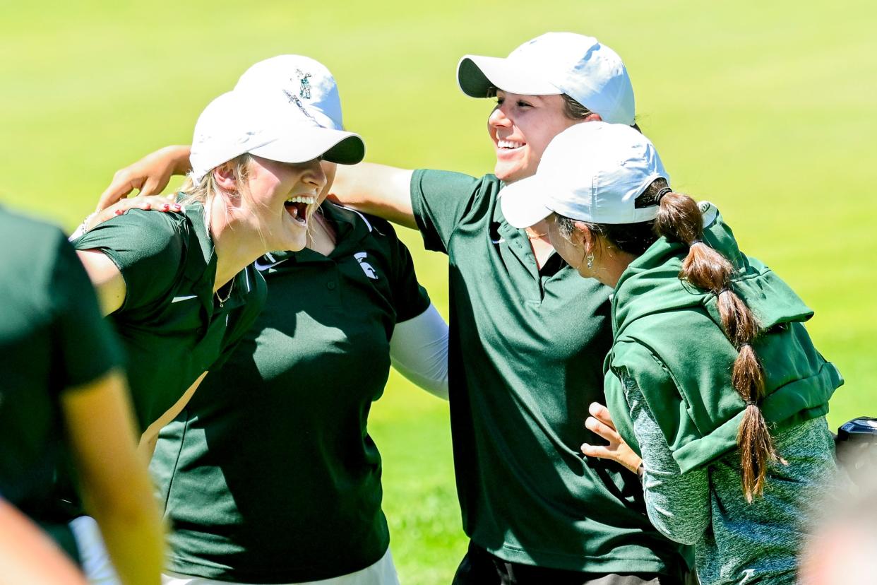 Michigan State's Leila Raines, center, celebrates with teammates after finishing the final round of the NCAA women's golf regional on Wednesday, May 8, 2024, at Forest Akers West Golf Course in East Lansing.