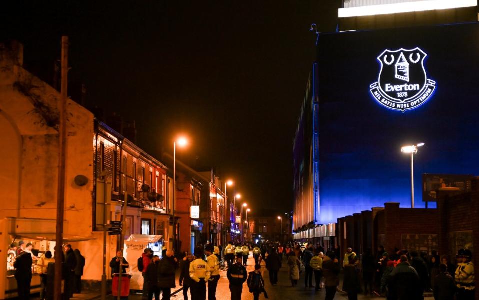 Fans arrive outside Goodison Park at night