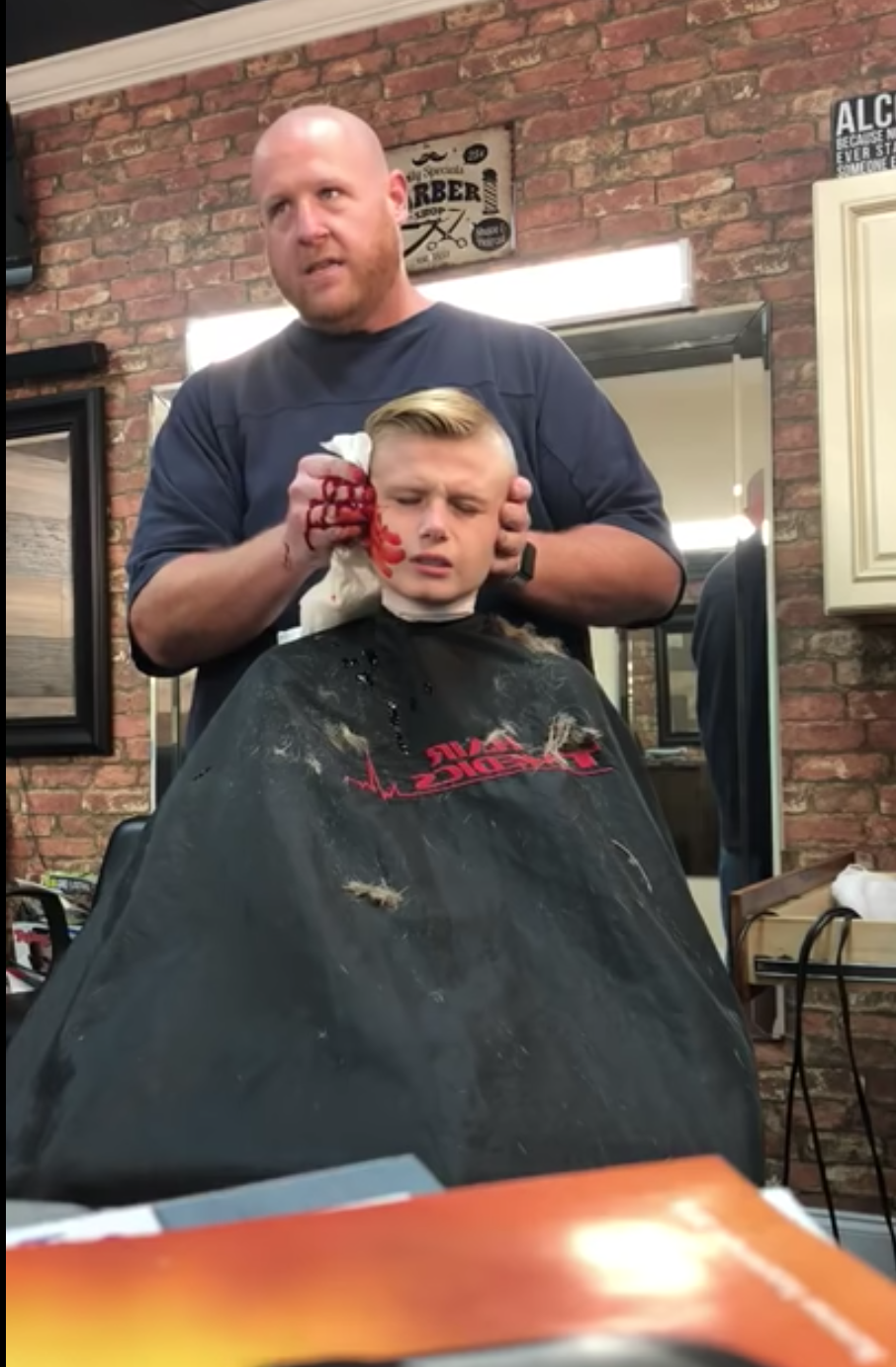 Barber Jude Sannicandro pranked a kid customer by pretending to accidentally cut off his ear. (Photo: YouTube/Jude Sannicandro)