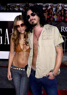 Gilby Clarke and gal Daniella at the Westwood premiere of Warner Brothers' Rock Star