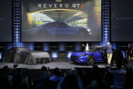 Karma Automotive's Dr. Lance Zhou, Chief Executive Officer, left, and Todd George, VP of Platform Engineering at Karma Automotive unveil Karman's Revero GT S at Automobility LA Auto Show in Los Angeles Tuesday, Nov. 19, 2019. (AP Photo/Damian Dovarganes)