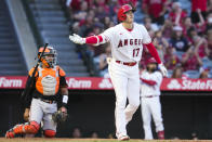 Los Angeles Angels designated hitter Shohei Ohtani (17) drops hit bat after hitting a home run during the third inning of a baseball game against the Baltimore Orioles Friday, July 2, 2021, in Anaheim. (AP Photo/Ashley Landis)