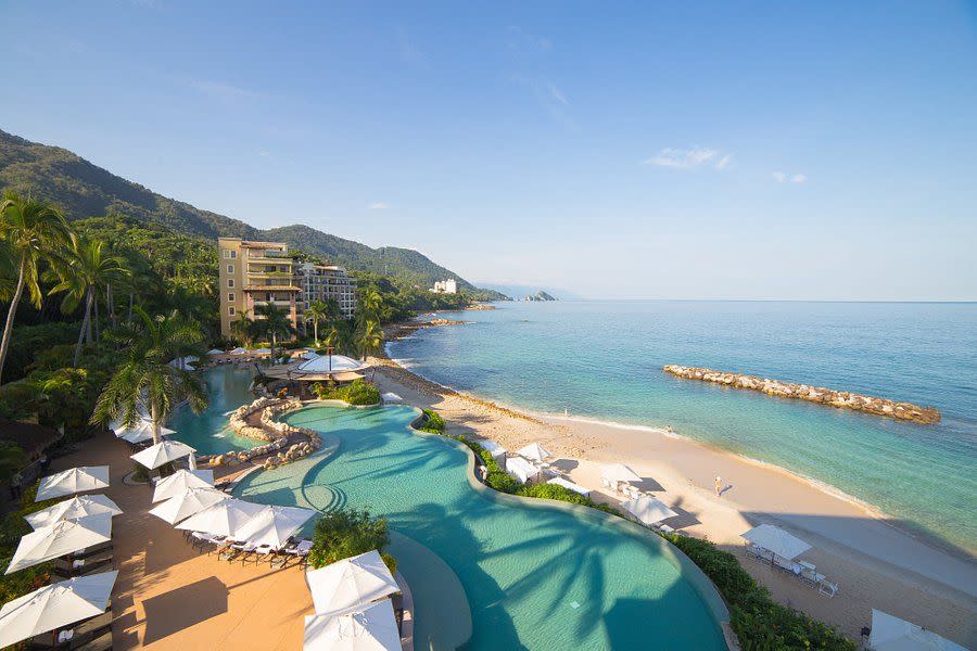 a resort with a pool and a beach