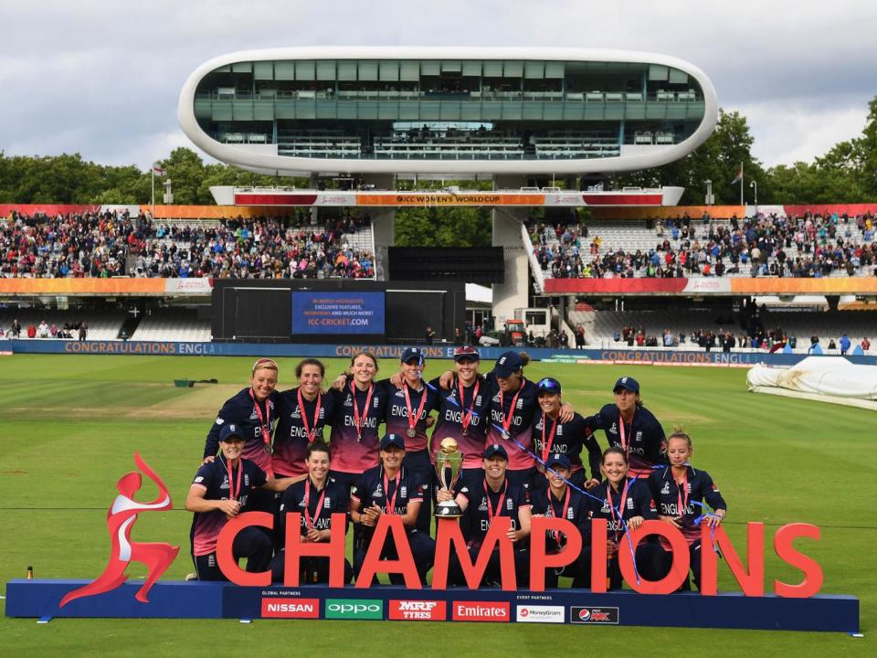 England Women are presented with the World Cup trophy (Getty)