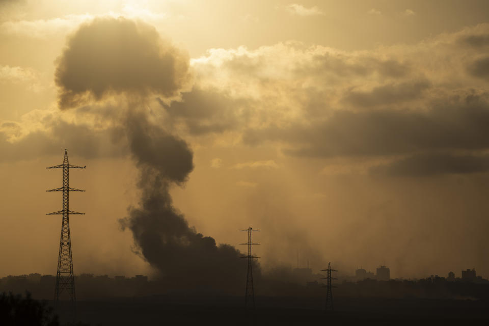 Smoke rises to the sky after an explosion in the Gaza Strip as seen from southern Israel, Monday, July 8, 2024. Israeli forces advanced deeper into the Gaza Strip's largest city in pursuit of militants who had regrouped there, sending thousands of Palestinians fleeing on Monday from an area ravaged in the early weeks of the nine-month-long war. (AP Photo/Leo Correa)