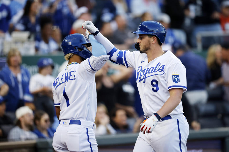 Kansas City Royals' MJ Melendez (1) congratulates Vinnie Pasquantino (9) as he crosses home plate after hitting a home run during the fourth inning of a baseball game against the Baltimore Orioles in Kansas City, Mo., Wednesday, May 3, 2023. (AP Photo/Colin E. Braley)