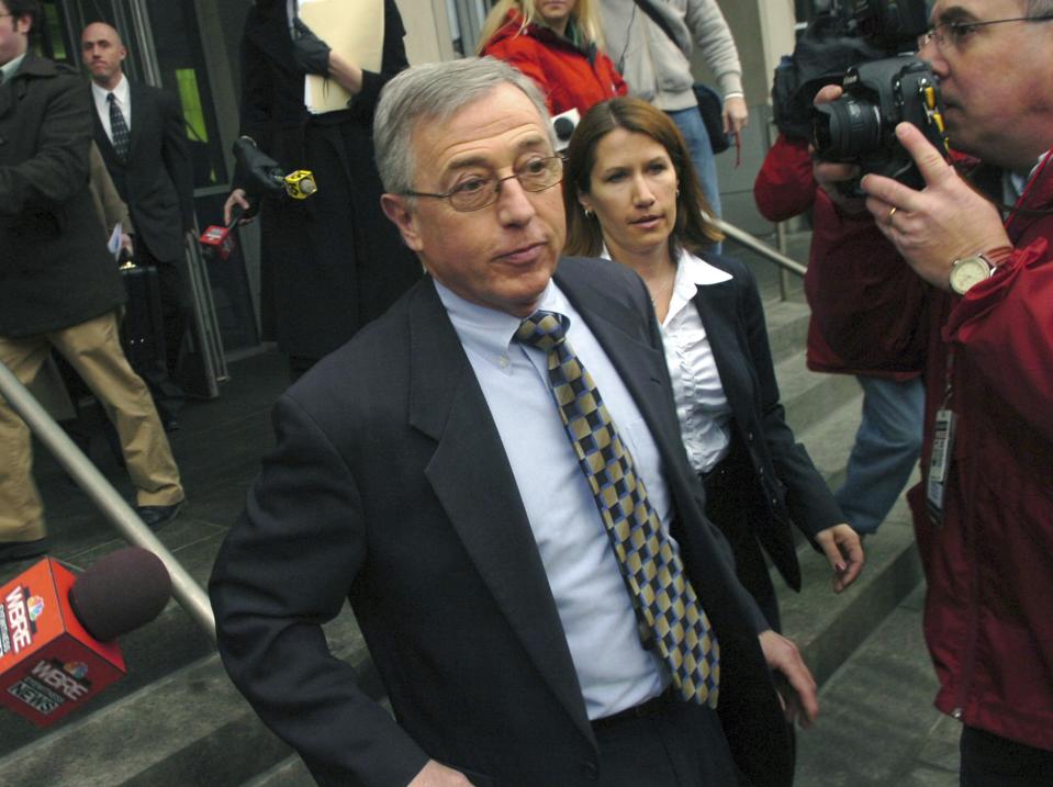 FILE - In this Feb. 12, 2009 file photo, former judge Mark Ciavarella, center, leaves the federal courthouse in Scranton, Pa. The film "Kids for Cash" set to open explores the scandal that entangled thousands of children in Pennsylvania's juvenile court system and sent two former judges to prison. Ciavarella is serving a 28-year sentence and fellow ex-judge Michael Conahan 17 years for taking $2.6 million from companies looking to build and fill a youth detention center for Luzerne County. (AP Photo/David Kidwell, File)