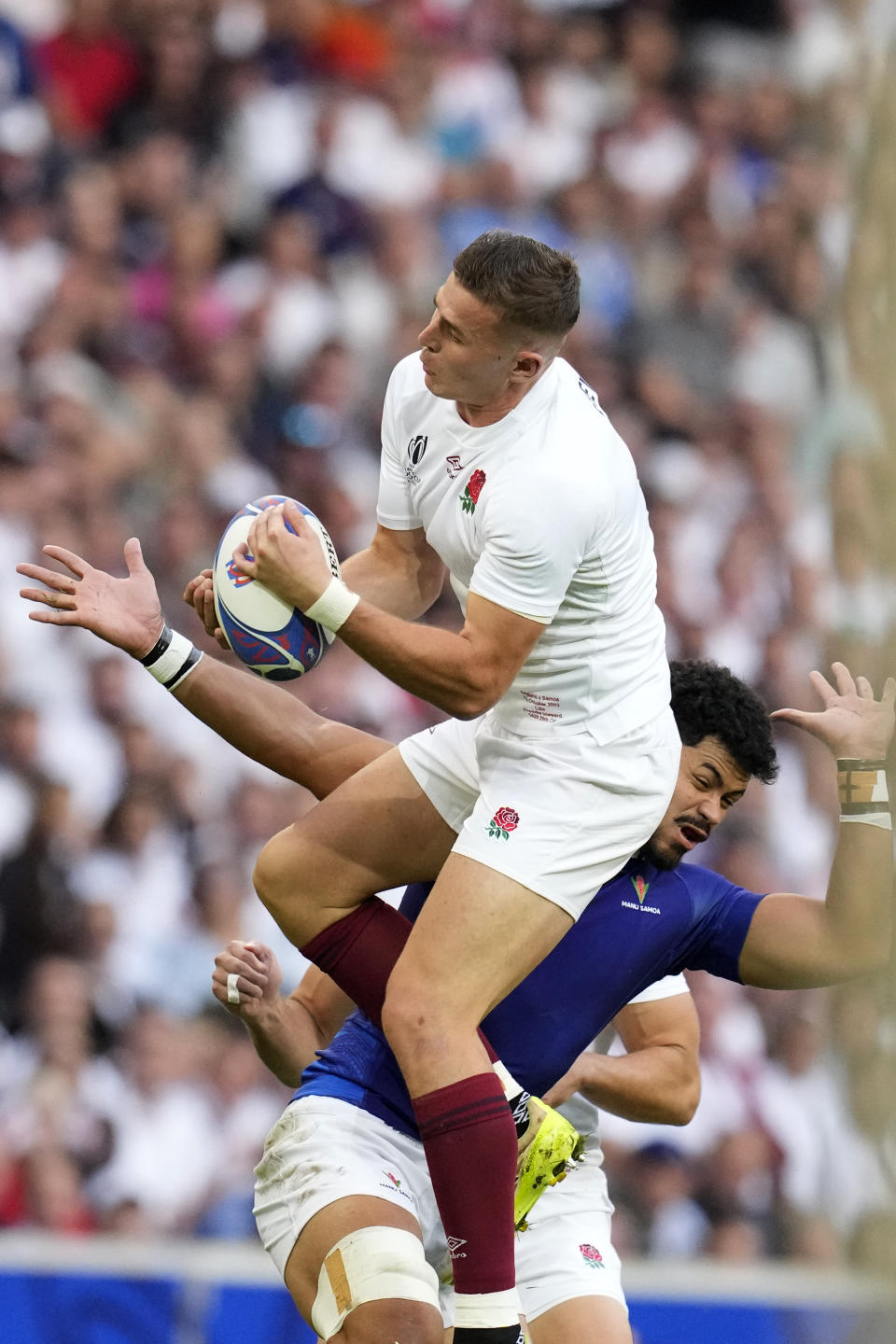 England's Freddie Steward catches the ball during the Rugby World Cup Pool D match between England and Samoa at the Stade Pierre Mauroy in Villeneuve-d'Ascq, outside Lille, France, Saturday, Oct. 7, 2023. (AP Photo/Themba Hadebe)