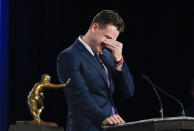 NCAA college football player, LSU quarterback Joe Burrow reacts while speaking after being awarded the Heisman Trophy, Saturday, Dec. 14, 2019, in New York. (Todd Van Emst/Pool Photo via AP)