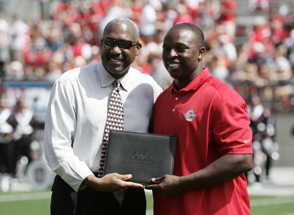 OSU athletic director Gene Smith poses with Mike Doss after Mike was industed into the Athletic hall of fame during halftime of the Toledo game played on Sept. 10, 2011 in Ohio Stadium.  (Photo by Mike Munden)