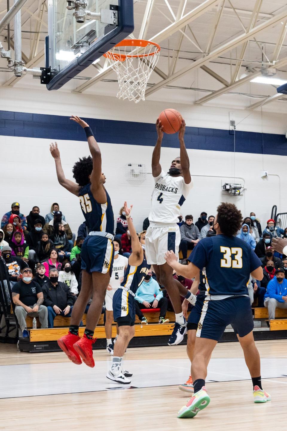 Newburgh Free Academy's Jah'Likai King (4) goes up for a shot in Sunday's Class AA semifinal playoff. King scored 22 points as Newburgh beat Pine Bush 67-52.  ALLYSE PULLIAM/For the Times Herald-Record