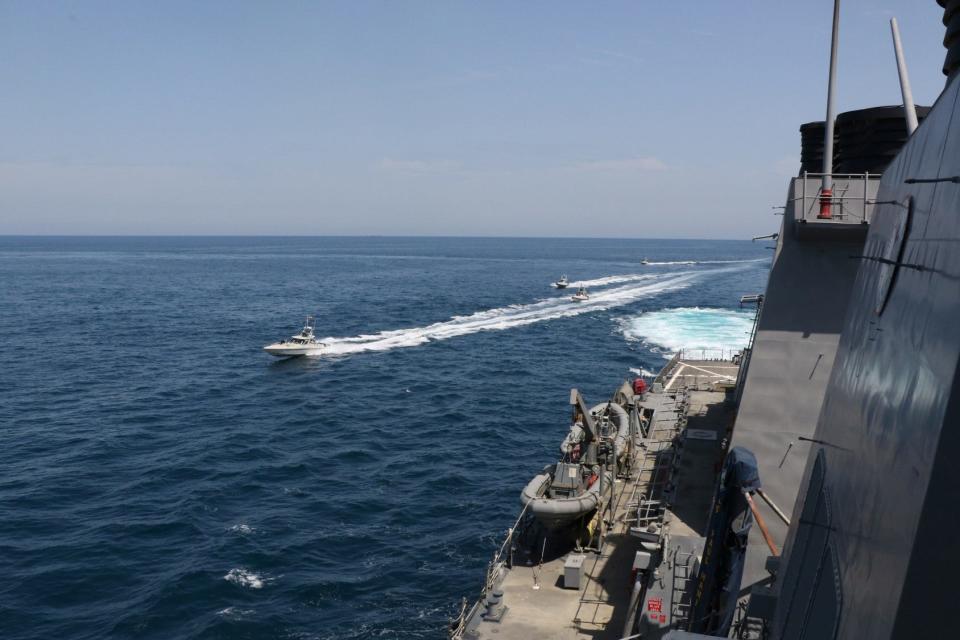 FILE PHOTO: Four Iranian Islamic Revolutionary Guard Corps Navy (IRGCN) vessels, some of several to maneuver in what the U.S. Navy says are 