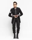 <p>shows off his trendsetter status in a military-inspired Dior suit and boots, plus Cartier jewelry. </p>