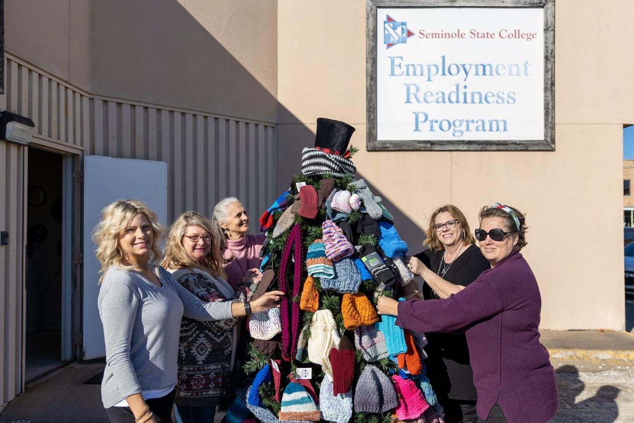 The Happy Holiday Tree, decorated with winter clothing items available to those in need, will be on display until December 26. Pictured (left to right): Workforce staffer Danita Williams, SSC Employee Readiness Assistant Job Skills Specialist Christina Parsons, SSC Vice President for Academic Affairs Dr. Linda Goeller, SSC Director of Employment Readiness Veronica Taylor and Workforce staffer Scarlet Figueroa.