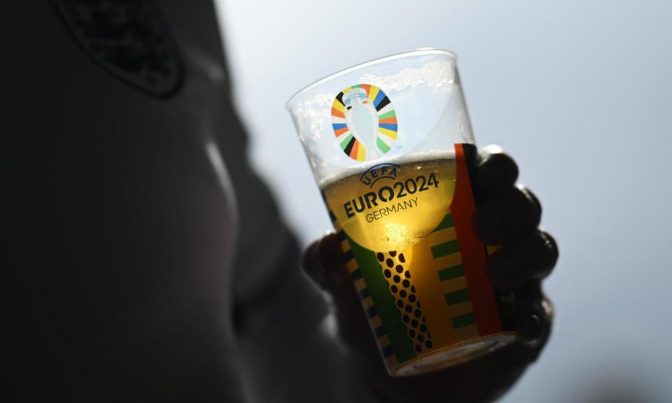 <span>In Gelsenkirchen the beer available in and around the stadium last Sunday was limited to 2% alcohol.</span><span>Photograph: Matthias Hangst/Getty Images</span>