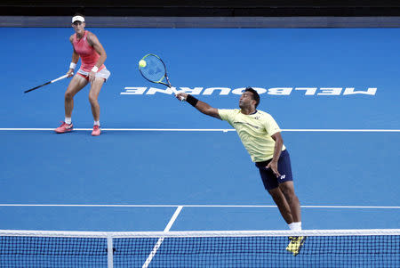 Tennis - Australian Open - Mixed Doubles Second Round - Melbourne Park, Melbourne, Australia, January 22, 2019. Australia's Samantha Stosur and India's Leander Paes in action during the match against Germany's Anna-Lena Groenefeld and Colombia's Robert Farah. REUTERS/Edgar Su