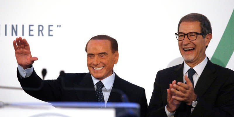 Forza Italia party leader Silvio Berlusconi (L) waves to supporters next to local candidate Nello Musumeci during a rally in Catania, Italy, November 2, 2017. REUTERS/Antonio Parrinello