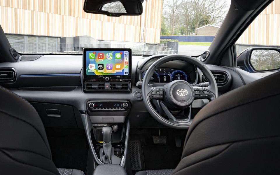 View of the dashboard of the Yaris from the backseat of the car