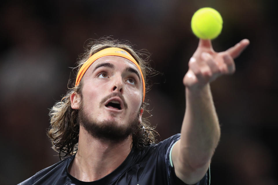 Greece's Stefanos Tsitsipas serves to Serbia's Novak Djokovic during their quarterfinal match of the Paris Masters tennis tournament Friday, Nov. 1, 2019 in Paris. (AP Photo/Michel Euler)