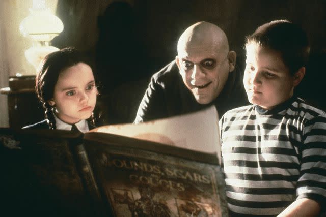 <p>Orion/Paramount/Kobal/Shutterstock</p> Christina Ricci, Christopher Lloyd, Jimmy Workman in 'The Addams Family'.
