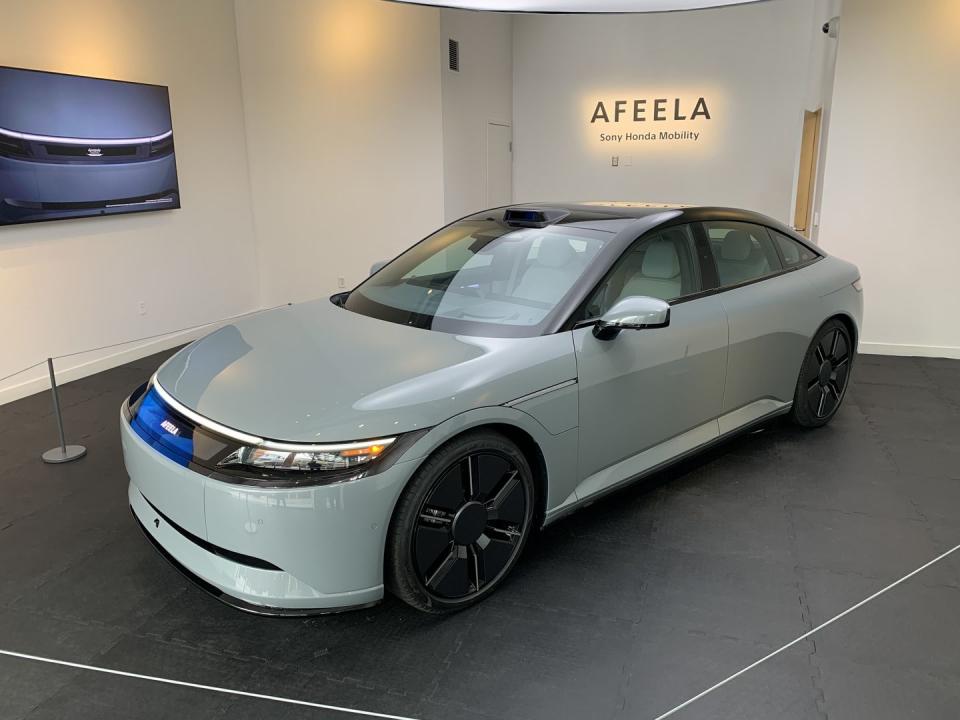 a white car parked in a showroom