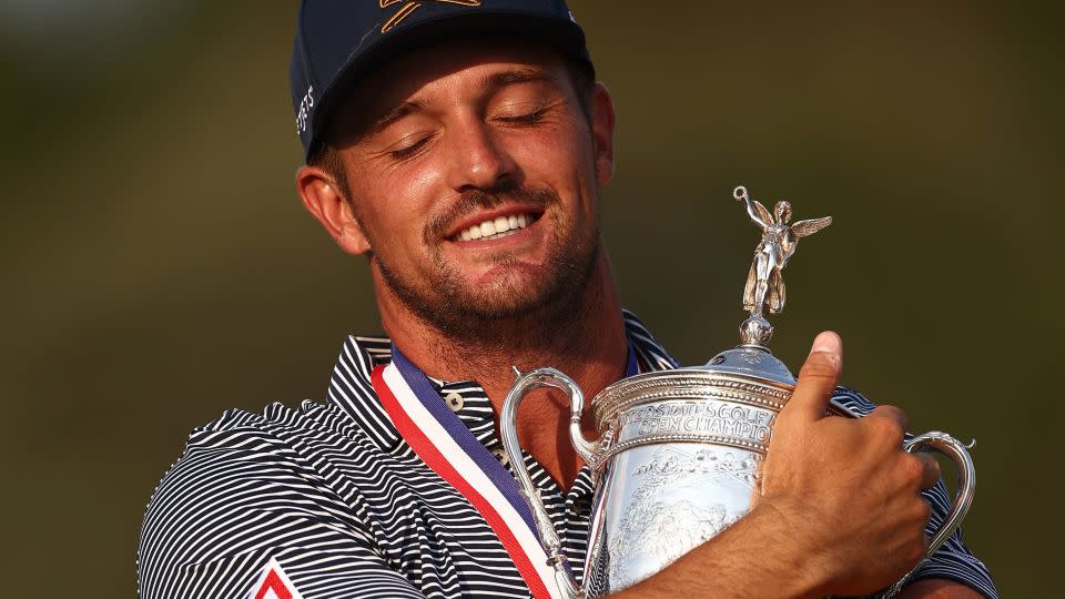 DeChambeau clutches the trophy. - Jared C. Tilton/Getty Images