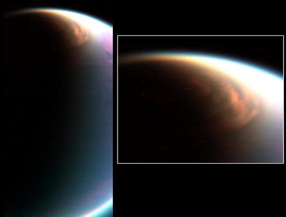 A methane ice cloud is seen over the north pole of Saturn's moon Titan in this view captured by NASA's Cassini spacecraft in December 2006. Scientists suspect that intense methane storms on Titan may also sculpt towering dunes at the moon's equ