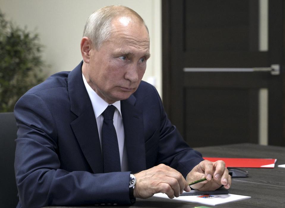 Russian President Vladimir Putin listens to deputy Prime Minister Yuri Borisov during their meeting after visiting the Zaliv shipyard in Kerch, Crimea, Monday, July 20, 2020. (Alexei Druzhinin, Sputnik, Kremlin Pool Photo via AP)