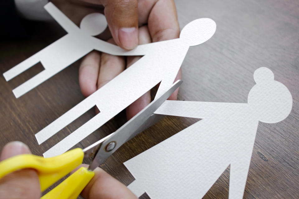 person making a paper family