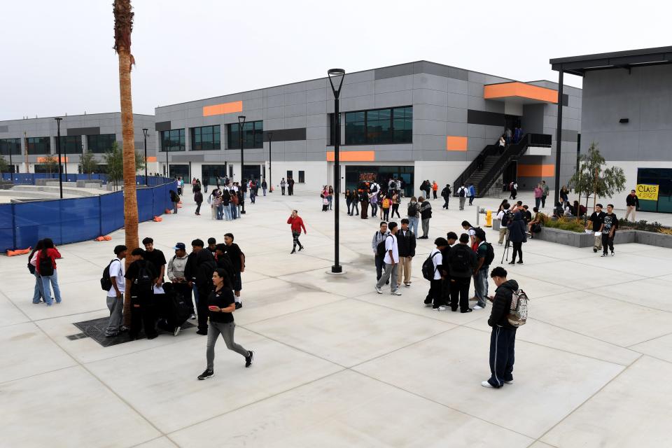 Students mingle on campus as they arrive for the first day of instruction at Del Sol High School in Oxnard on Aug. 16. The school's electricity has been supplied by diesel generators since November 2022.