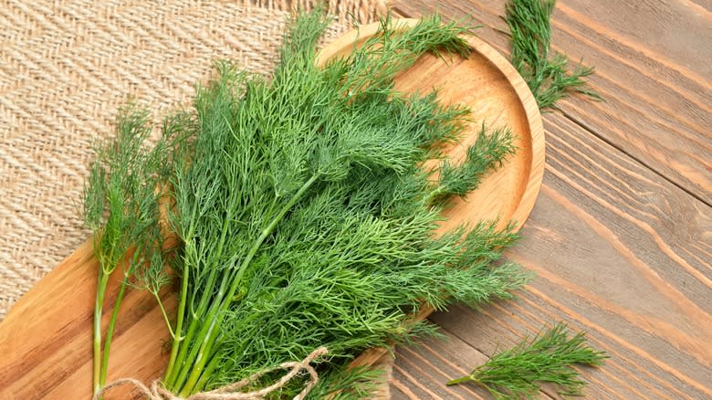 Fresh dill on chopping board