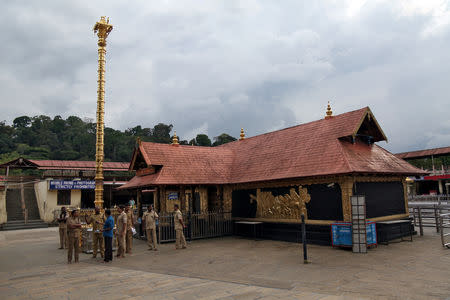 FILE PHOTO: Police stand inside the premises of the Sabarimala temple in Pathanamthitta district in the southern state of Kerala, India, October 17, 2018. REUTERS/Sivaram V/File Photo