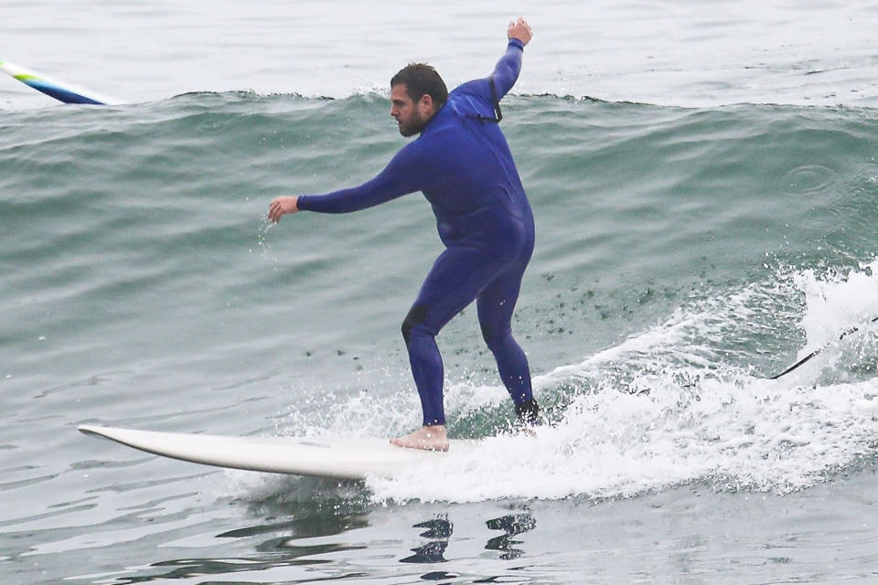 <p>Jonah Hill rides a few waves in Malibu, California, on Saturday.</p>