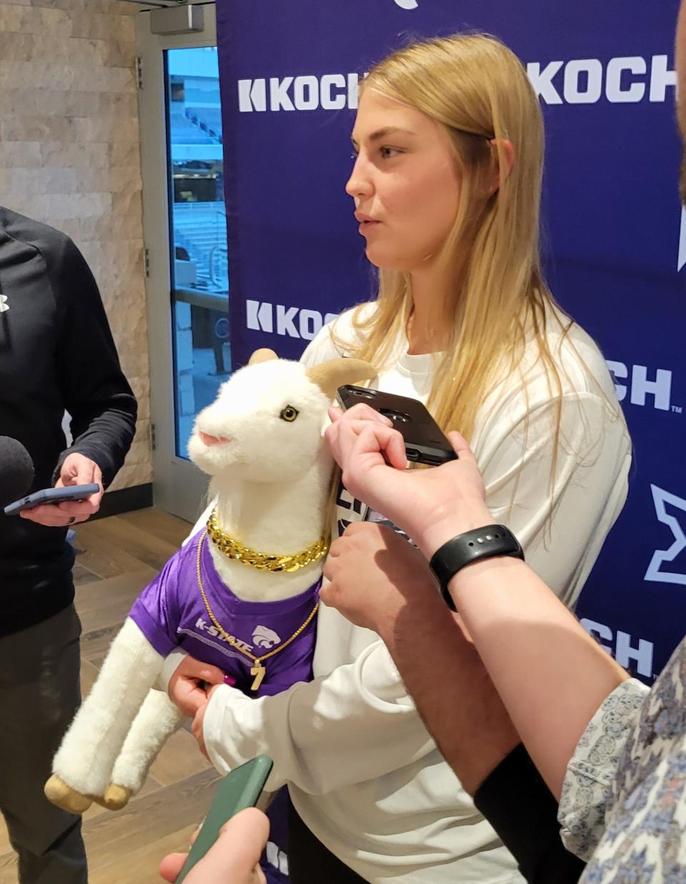 Kansas State guard Gabby Gregory talks to reporters while holding Gappy the Gap Goat mascot on NCAA Tournament selection Sunday at Bramlage Coliseum in Manhattan.