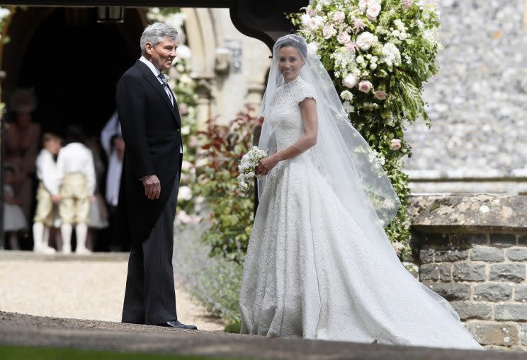 Pippa’s bodice and train are dotted with pearls. Her veil is by British milliner Stephen Jones [Photo: PA]