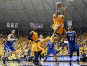 Wichita State's Tekele Cotton drives to the basket against Drake, during the second half of an NCAA basketball game, Saturday, Feb. 22, 2014 in Wichita, Kan. (AP Photo/The Wichita Eagle, Fernando Salazar) LOCAL TV OUT; MAGS OUT; LOCAL RADIO OUT; LOCAL INTERNET OUT