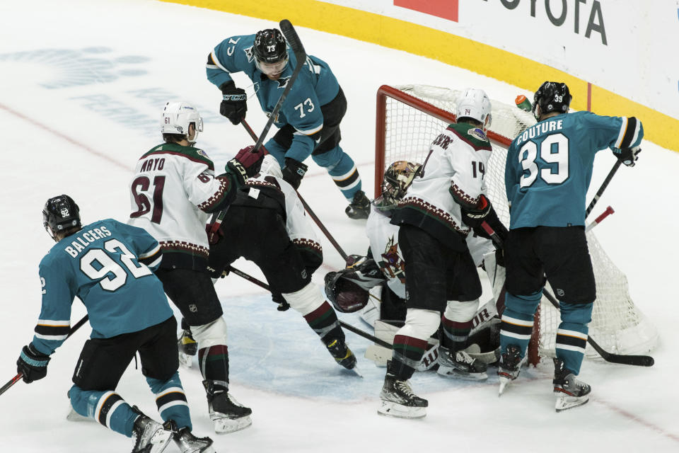 San Jose Sharks center Noah Gregor (73) scores a goal against Arizona Coyotes goaltender Karel Vejmelka (70) during the third period of an NHL hockey game Sunday, March 20, 2022, in San Jose, Calif. The Sharks won 4-2. (AP Photo/John Hefti)